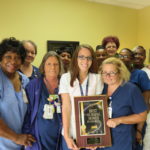 EHS Care Center staff with 2015 Best Nursing Homes in Georgia Plaque